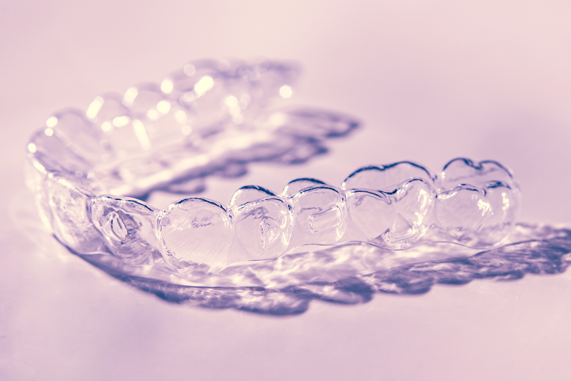 Close-up of clear aligner on teeth