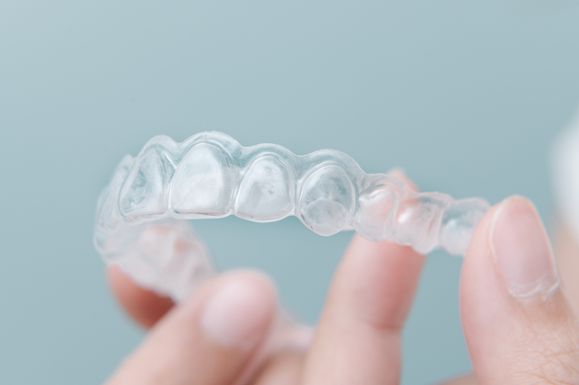 Patient removing clear aligner