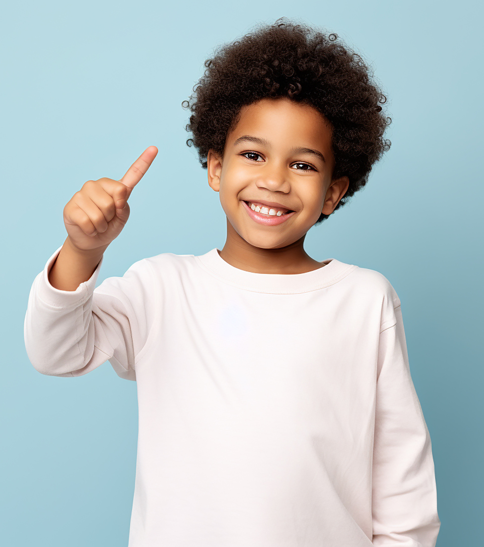 Little boy with braided hairstyle smiling