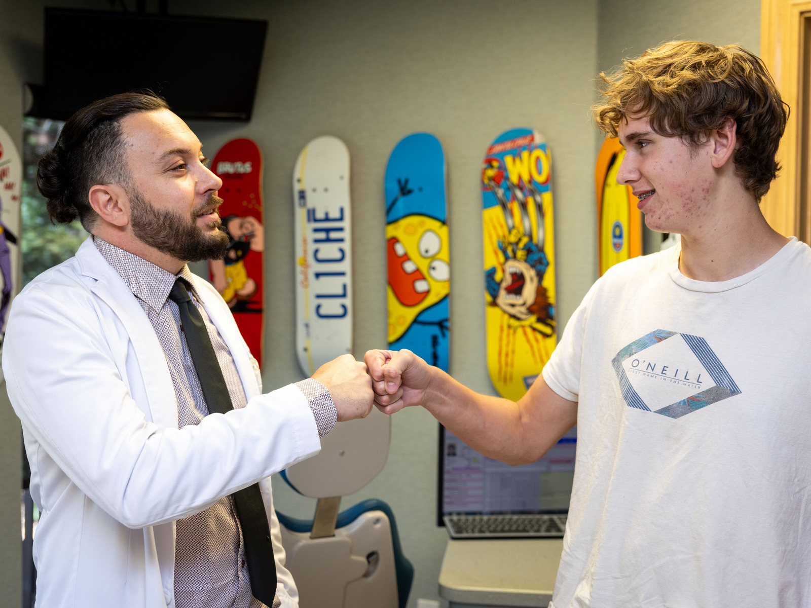 Dr. Nejat with a teenage patient