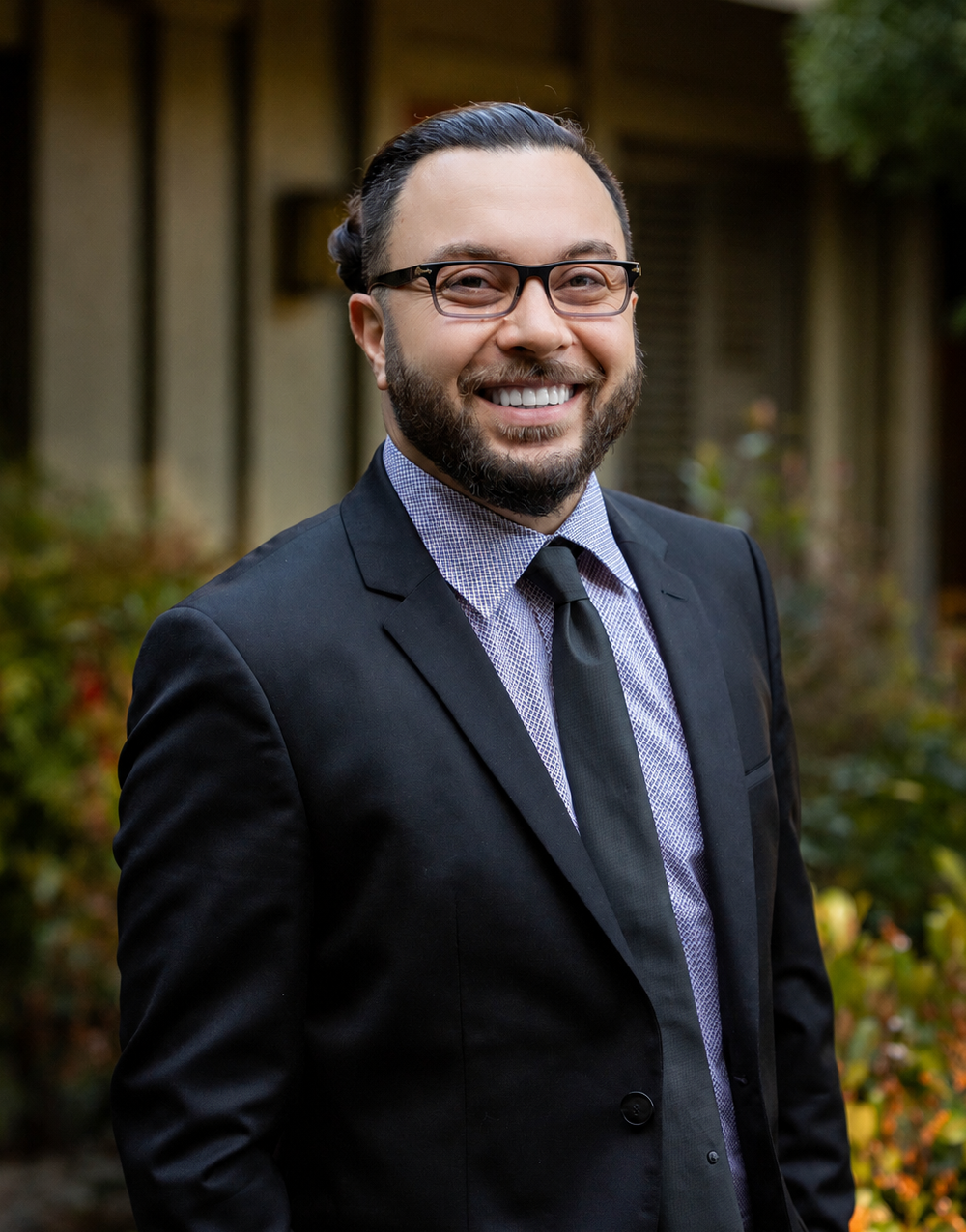 Dr. Behzad Nejat smiling in his orthodontic office