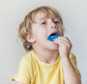 Three-year-old boy with myofunctional trainer for bite correction